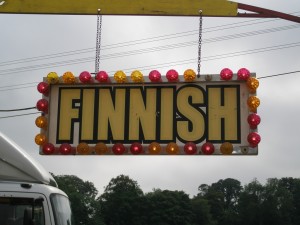 end a conference: A photograph of a large sign hanging from an overhead beam that says "FINNISH". Image attribution: http://www.flickr.com/photos/ilike/ / CC BY-NC-ND 2.0