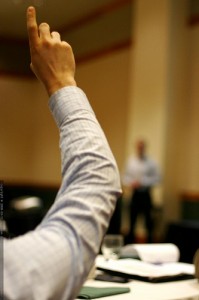 fundamental questions conference design. Photograph of a raised arm with a finger pointing upward. Image attribution: http://www.flickr.com/photos/seandreilinger/ / CC BY-NC-SA 2.0