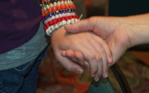 willing to be disturbed: close up photograph of holding hands