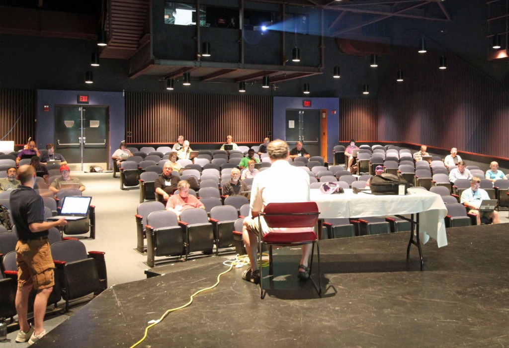 innovative participatory conference session: photograph of participants working on the edACCESS 2010 Web 2.0 case study