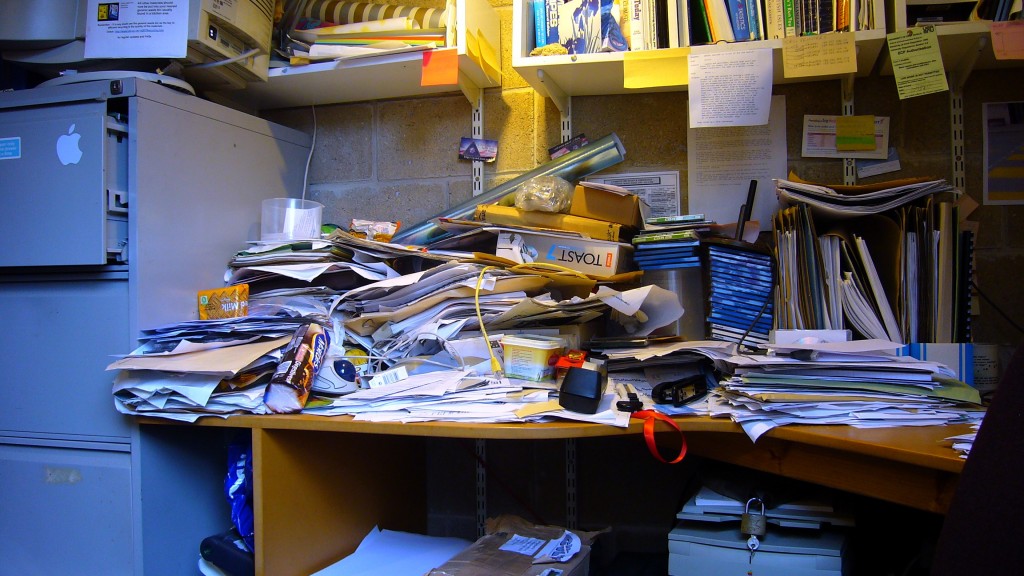 improving your personal work environment: a photograph of an incredibly messy desk. Image attribution: Flickr user harryharris