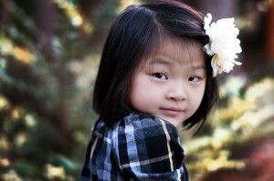 events that tug at heartstrings: A photograph of a young girl with a pink flower in her hair