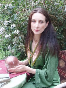 A photograph of a woman fortune teller holding a crystal ball