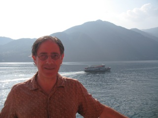 travel broadens the (event design) mind: Adrian Segar on a ferry on Lake Como