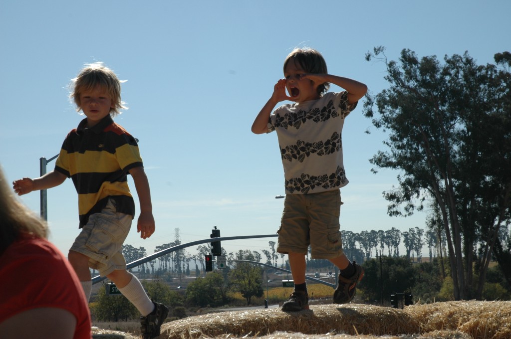 welcome conference newbies: photograph of two children buddies playing together. Photo attribution: Flickr user babageik.