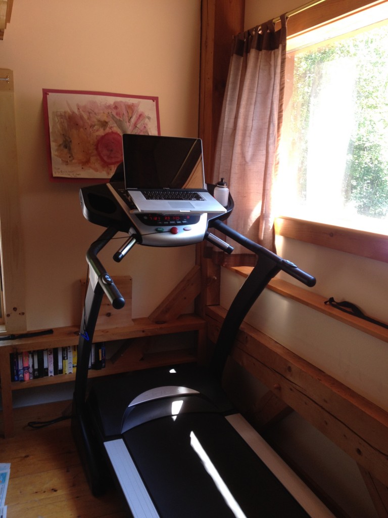 Walking to work: photograph of my home treadmill desk; simply a treadmill with an added shelf for a laptop 
