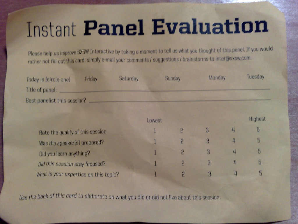 A photograph of a conventional conference panel evaluation