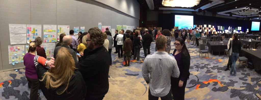 photograph of participants discussing during the GMIC 2014 conference "from broadcast to learning" RSQP collaboration session