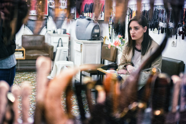 boredom is just a state of mind: photograph of a bored woman sitting in a store. Photo attribution: Flickr user spyrospapaspyropoulos