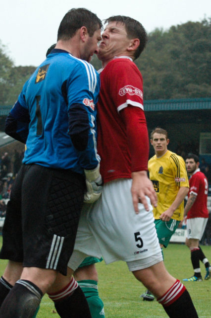 collision of agreements: photograph of two soccer players going for the ball and colliding. Photo attribution: Flickr user manc72.