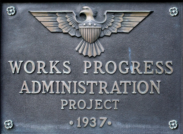 get better at doing anything: a photograph of a 1937 metal WORKS PROGRESS ADMINISTRATION PROJECT plaque