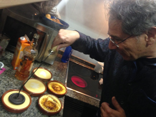 easier attendee participation: Adrian Segar caramelizes crème brûlée at a private dinner in Spain