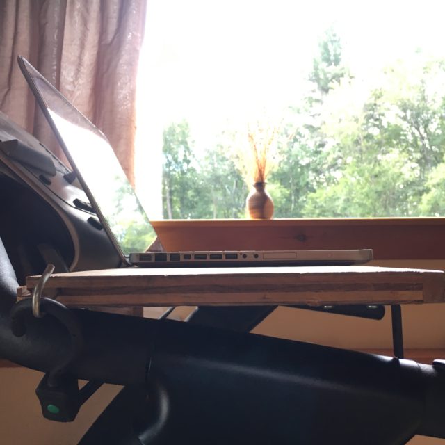 My treadmill desk — the next generation: a photograph of the simple, inexpensive, wooden shelf I added to my treadmill