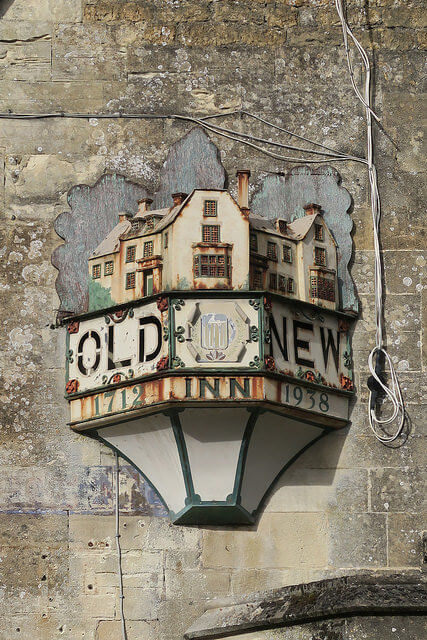 Does the world of events need more exposure to the new? A photograph of an old three-sided inn sign mounted on a wall with the words "OLD" and "NEW" on the left and right sides and a model of the inn on top. Photo attribution: Flickr user 64700647@N06