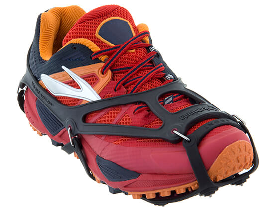 wear for winter running: photograph of a running shoe with Kahtoola NANOspikes installed