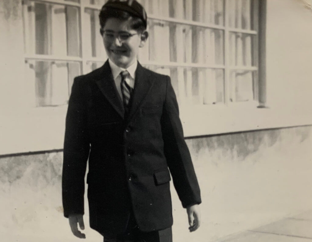 The author, Adrian Segar, at around 12 years old, wearing his school uniform