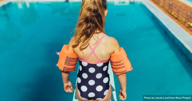 Trust safety learning: photograph of a young girl learning springboard diving at an outdoor pool by Jacob Lund from Noun Project