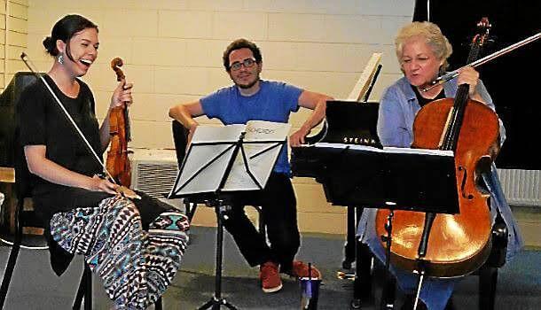 entrance layer: photograph of three musicians playing violin, piano, and cello. The cellist, Marcy Rosen, is leading a rehearsal at the Marlboro Music Festival.