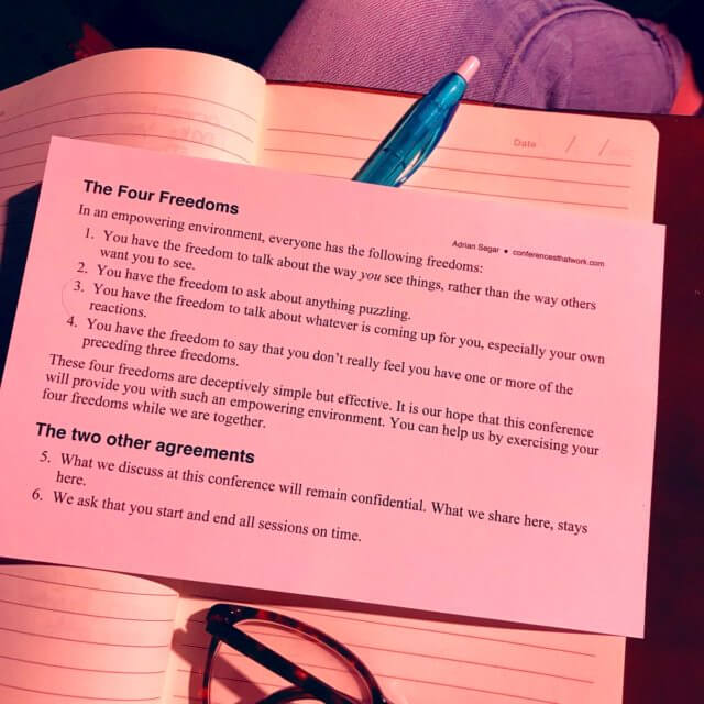 The fairest rules for meetings. Photograph of a card showing the six rules Adrian Segar uses for meetings: The Four Freedoms and two other agreements. The card is laying on a notebook, together with a pen and glasses. 