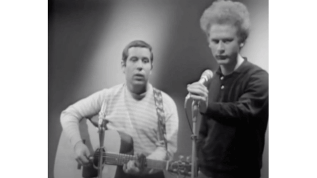 A black and white photo of Simon and Garfunkel singing "The sound of silence"