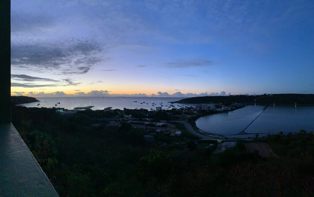 The sun sets over a Caribbean harbor.